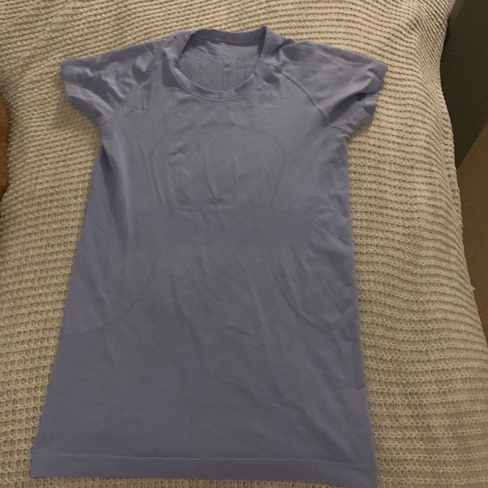 Selling a used size 6 lilac purple swiftly tech shirt